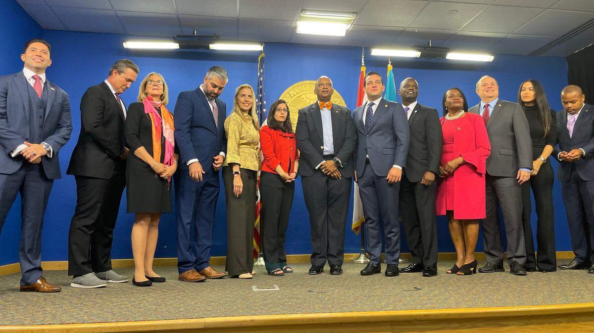 Photographed on Dec. 6, 2022, six of these 13 Miami-Dade commissioners would have mistakes in their compensation worth thousands of dollars. Those with paycheck errors recently confirmed by the county’s Human Resources Department are: Roberto Gonzalez, far left; Anthony Rodrigez, fourth from left; Micky Steinberg, sixth from left; Kevin Cabrera, sixth from right; Marleine Bastien, fourth from right, and Juan Carlos Bermudez, third from right. Also pictured, from left to right: Rene Garcia, Eileen Higgins, Raquel Regalado, Chairman Oliver Gilbert, Kionne McGhee, Danielle Cohen Higgins and Keon Hardemon.