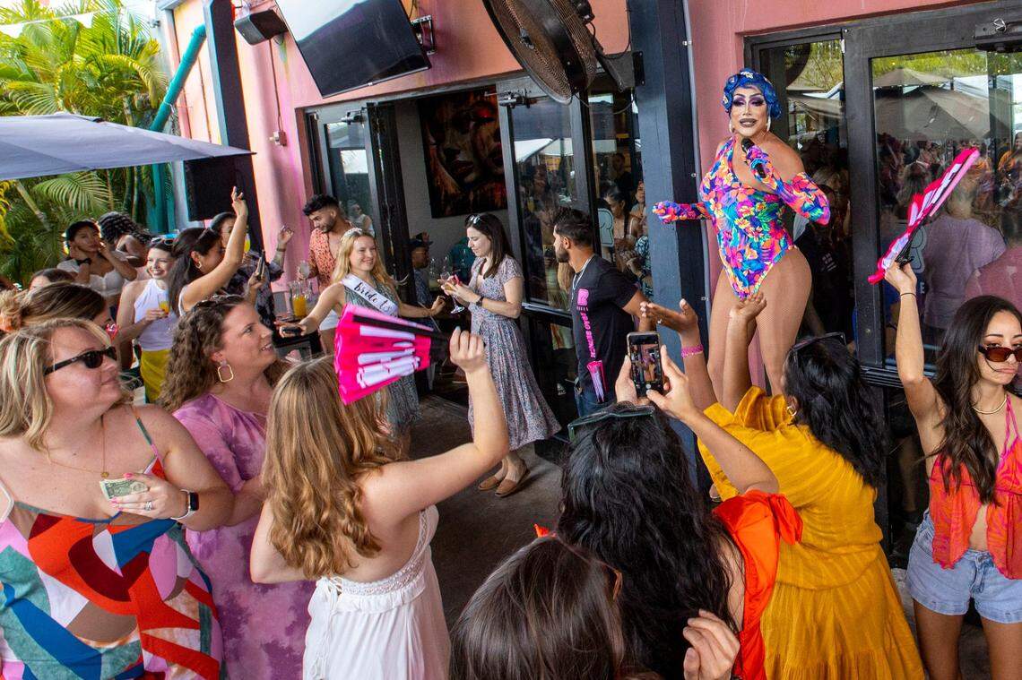Host Athena Dion speaks to guest during brunch at R House in Wynwood.
