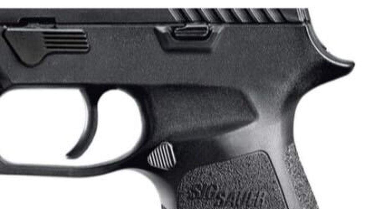 A pistol sold in the US and made by Sig Sauer fires without touching the trigger, a lawsuit says. Several are suing after getting hurt.