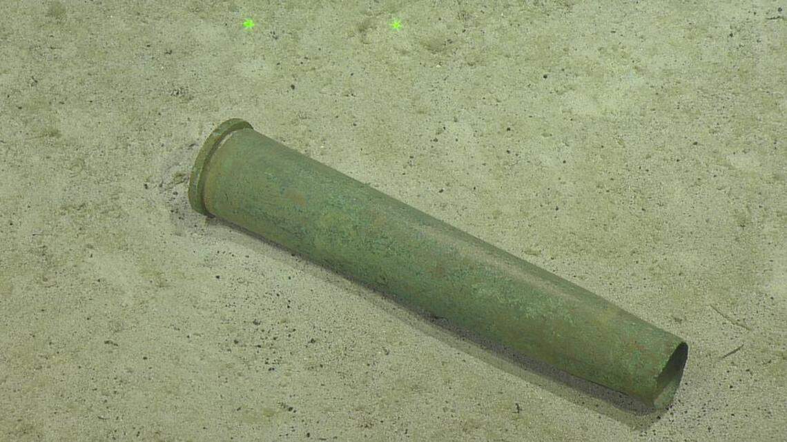 A group of deep sea explorers found a random artillery shell in an otherwise tidy bit of Pacific seafloor, leaving them guessing over how it ended up in the middle of nowhere.
