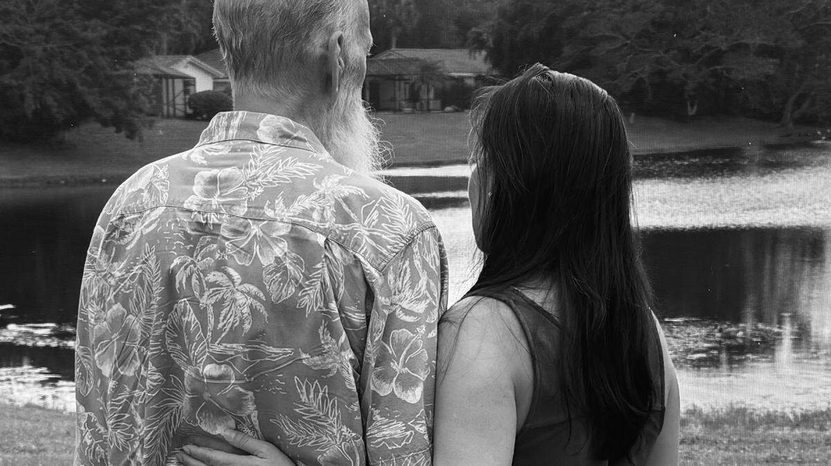 Michael Davis, who is recovering from cardiac surgery, and his wife Donna in the backyard of their Boca Raton home in October 2025.