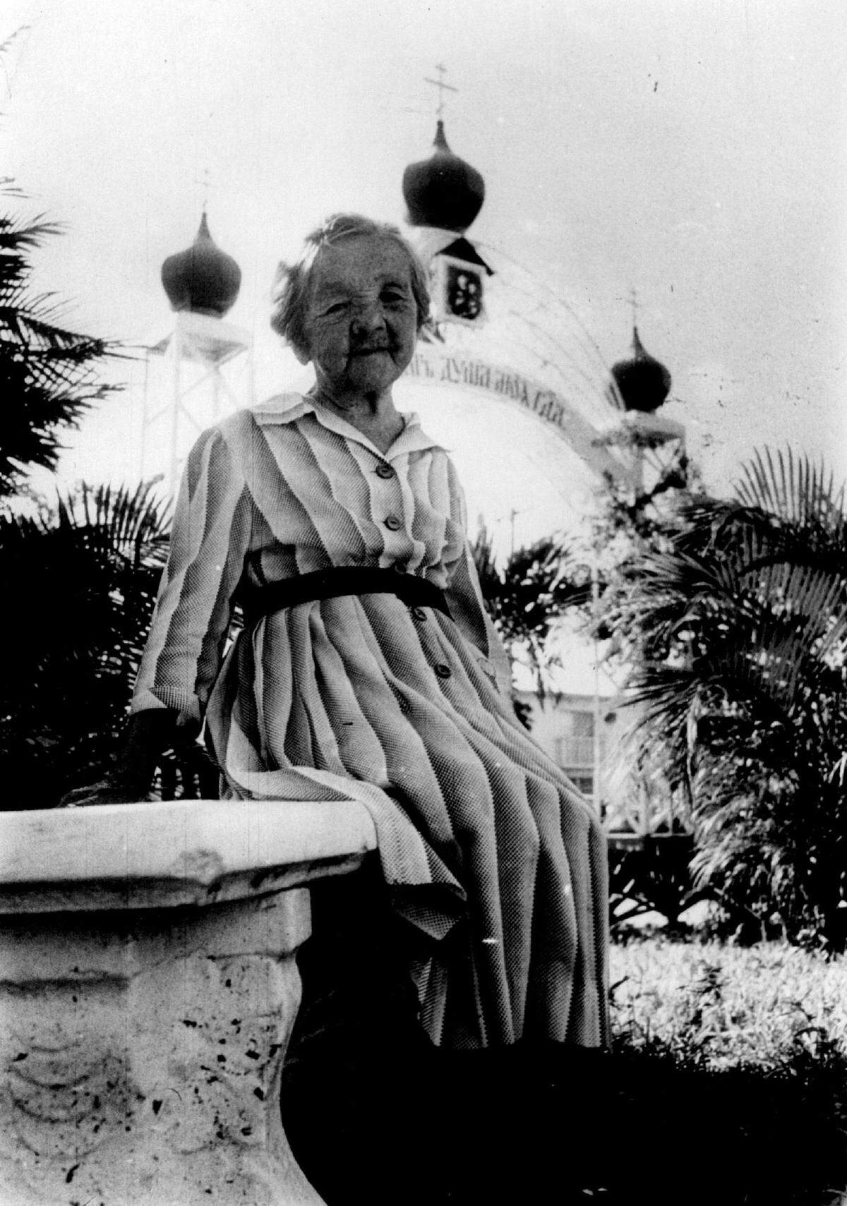 Maria Fillina sitting in the courtyard of St. Vladimir Russian Orthodox Church. She was the last surviving member of the Royal Russian Midgets performance troupe. In the 1930s, they bought land off the Tamiami Trail and were among the founders of the city of Sweetwater. In 1947, they helped found St. Vladimir Russian Orthodox Church, which is located off Flagler Street in Miami.
