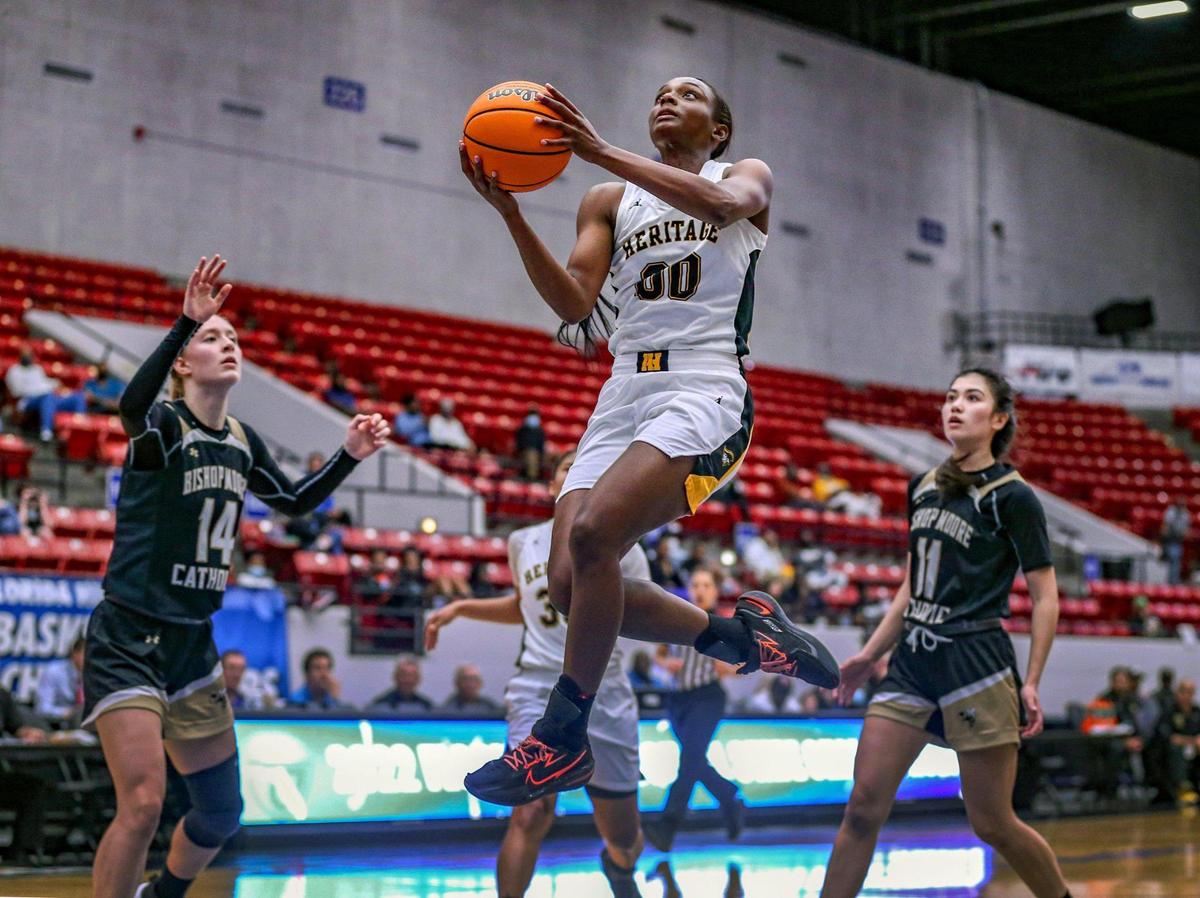 Ta’Niya Latson (00) gets inside to score against Bishop Moore in the Class 5A girls basketball state championship at the RP Funding Center in Lakeland on Saturday, February 26, 2022.