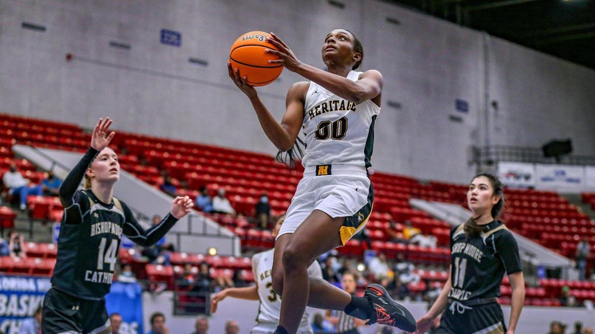 Ta’Niya Latson (00) gets inside to score against Bishop Moore in the Class 5A girls basketball state championship at the RP Funding Center in Lakeland on Saturday, February 26, 2022.