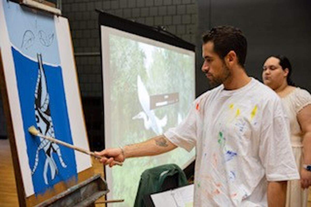 JC Gutierrez as Artist X and Laney Rodriguez as Chorus Leader channel the advocate spirit of Xavier Cortada in “Flying Solo with Artist X” at Westchester Cultural Arts Center.