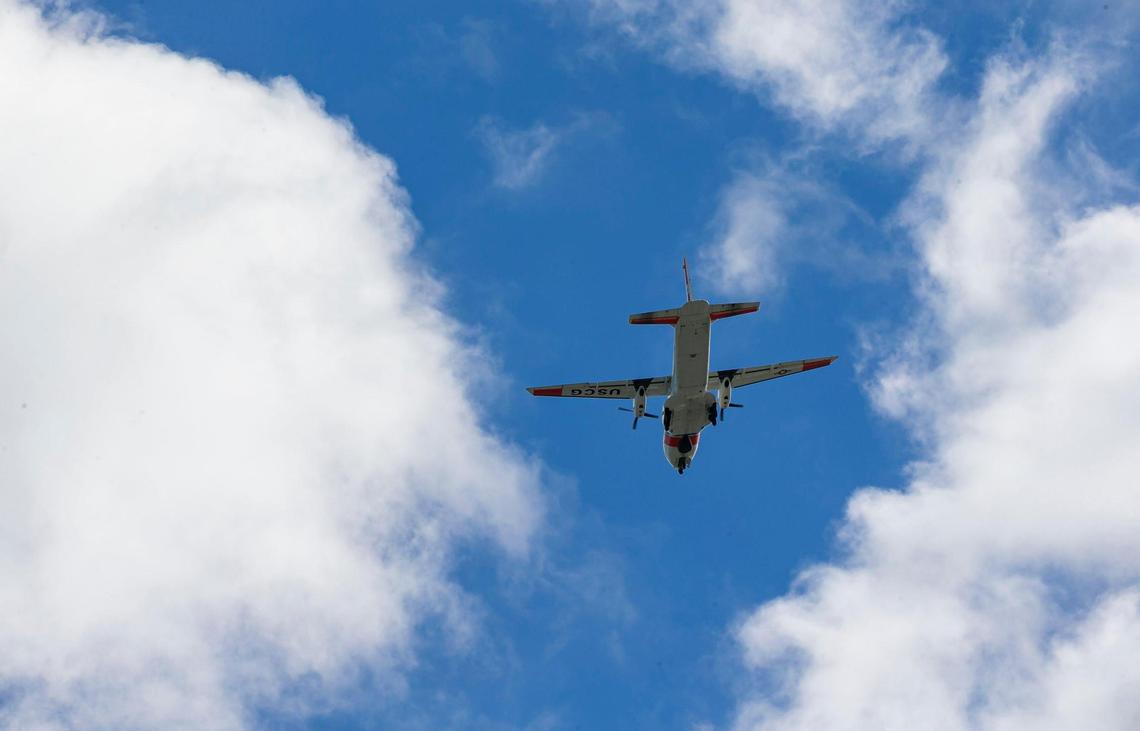 A U.S. Coast Guard airplane flies over the U.S. Customs and Border Protection office in the Middle Florida Keys city of Marathon on Sunday, Jan. 8, 2023.