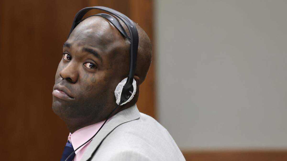 Cuban rapper Yosvanis “Chocolate MC” Sierra Hernandez sits next to his attorney Adolfo Gil during the first day of his trial for solicitation of first-degree murder as prosecutors presented their witness in Courtroom 7-4 at the Richard E. Gerstein Justice Building on Wednesday, November 12, 2025, in Miami, Florida. 