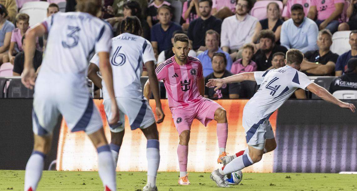 Inter Miami defender Jordi Alba (18) looks to pass the ball as Chicago Fire defender Jonathan Dean (24) defends in the first half of their MLS match at Chase Stadium on Tuesday, Sept. 30, 2025, in Fort Lauderdale, Fla.
