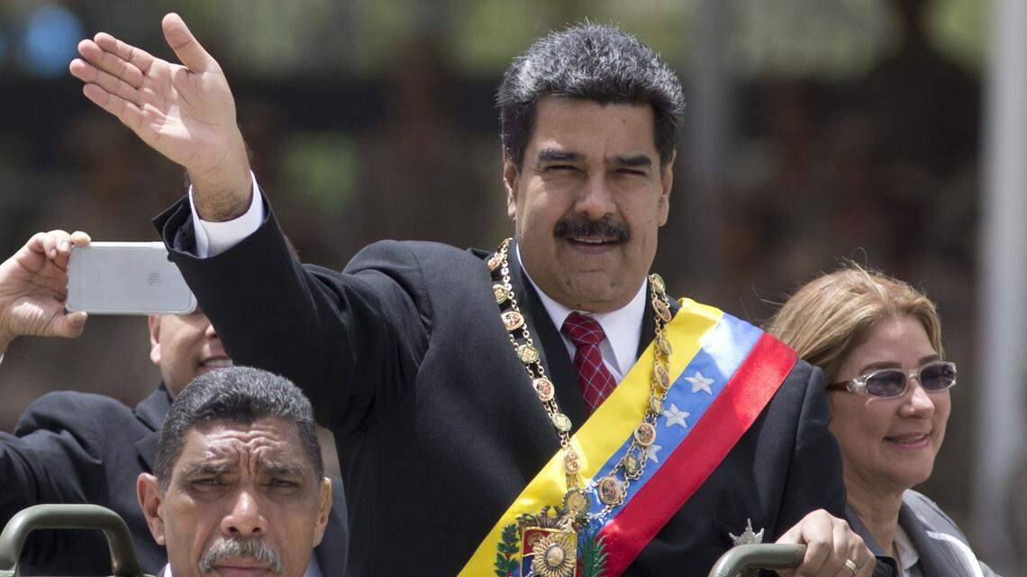 File photo of Venezuela’s President Nicolas Maduro alongside first lady Cilia Flores as they ride in an open vehicle during a military parade marking the Independence Day in Caracas, Venezuela, Thursday, July 5, 2018.