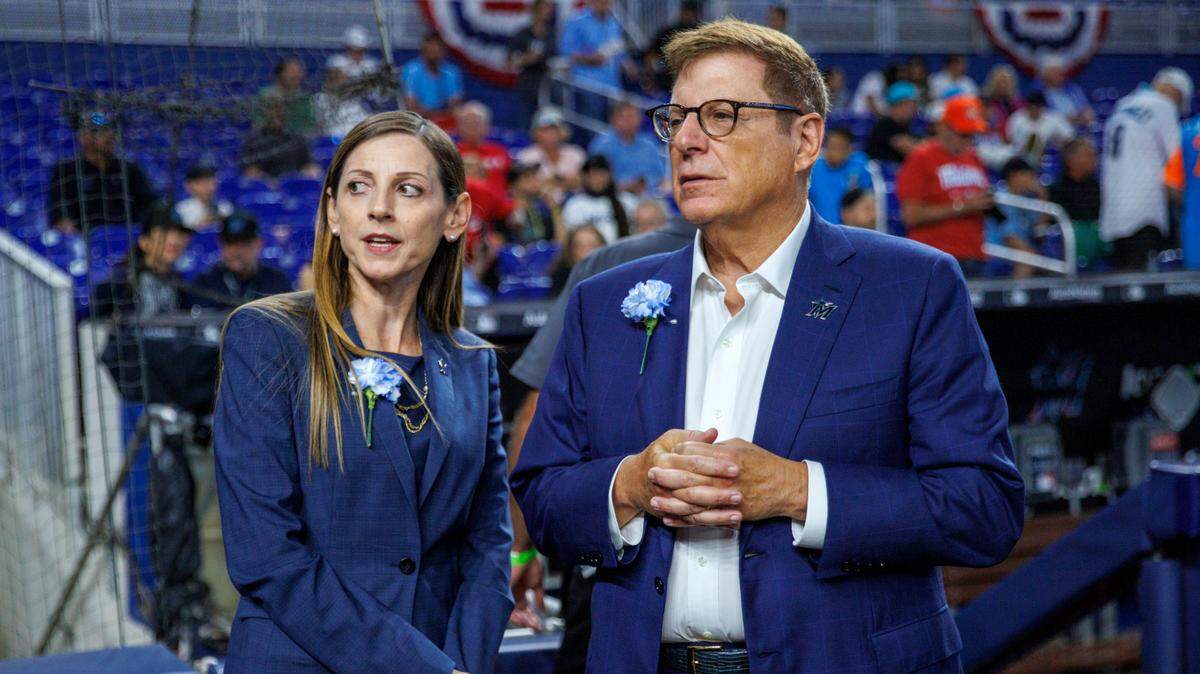 Miami Marlins chairman & principal owner Bruce Sherman talks with Caroline O’Connor before the team’s season home opener on April 14, 2022. The Marlins on Monday promoted O’Connor to president of business operations.