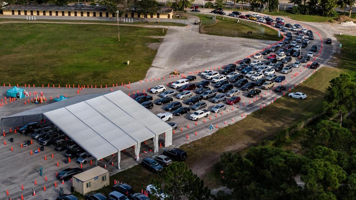 On Jan. 4, people wait, lined up in cars at Tropical Park, to get tested for COVID-19.