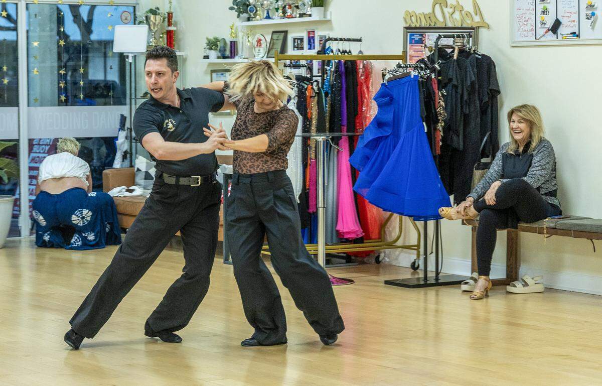 Student Xiomara Torrens (far right) reacts as dance instructors Ksenia Kasper and Stefan Ilies (right), rehearsed during a class at Let's Dance Miami studio in Aventura, on Wednesday, February 18, 2026.