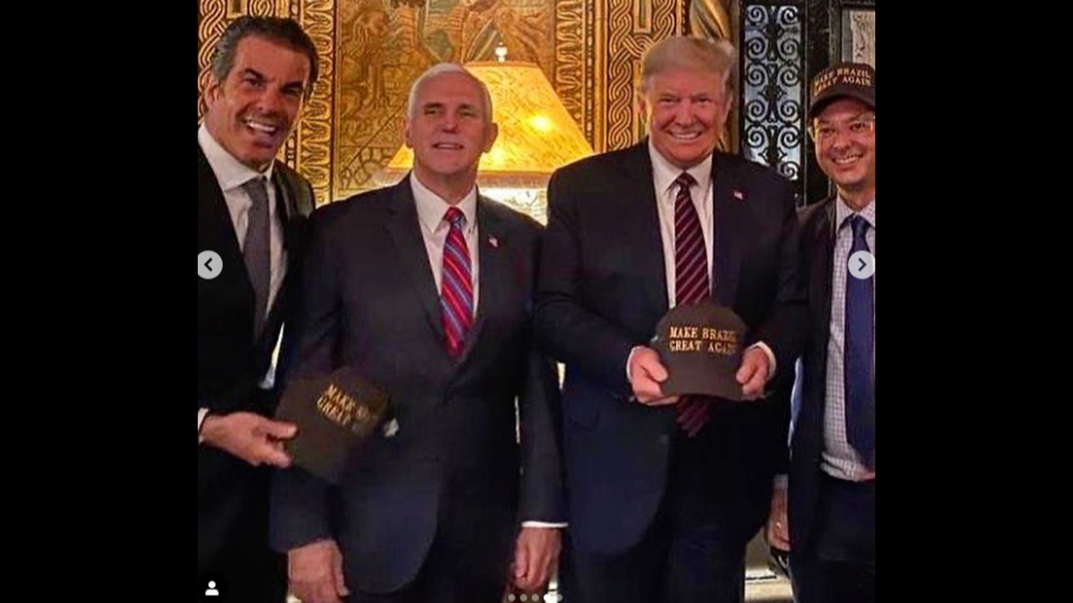 A scene from the event at Mar-a-Lago: Alvaro Garnero, Vice President Mike Pence, President Donald Trump and Fabio Wajngarten, press secretary for Brazilian President Jair Bolsonaro. Wajngarten has tested positive for COVID-19, the illness caused by the coronavirus.