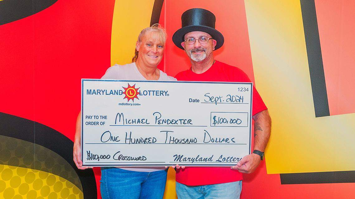 Michael and Carrie Pendexter pose with their $100,000 top-prize Maryland lottery win.
