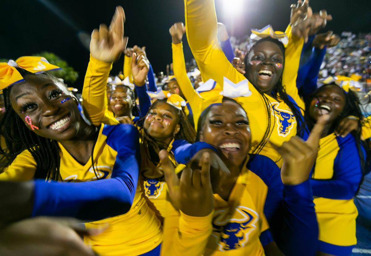 Northwestern Bulls cheerleaders react after their football team scored against the Miami Central Rockets on Friday, October 1, 2021 at Nathaniel Traz Powell Stadium in Miami, Florida.