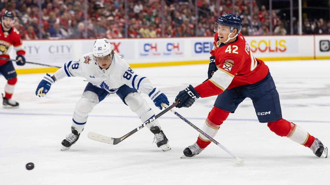 Florida Panthers defenseman Gustav Forsling (42) takes a shot toward goal as Toronto Maple Leafs right wing William Nylander (88) defends in the second period of their NHL game at the Amerant Bank Arena on Thursday, Oct. 19, 2023, in Sunrise, Fla.