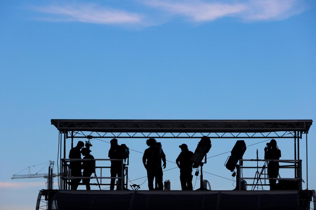 Light operators work the stage from a platform during the 19th annual Best of the Best International Music Festival at Bayfront Park in downtown Miami, Sunday, May 25, 2025.