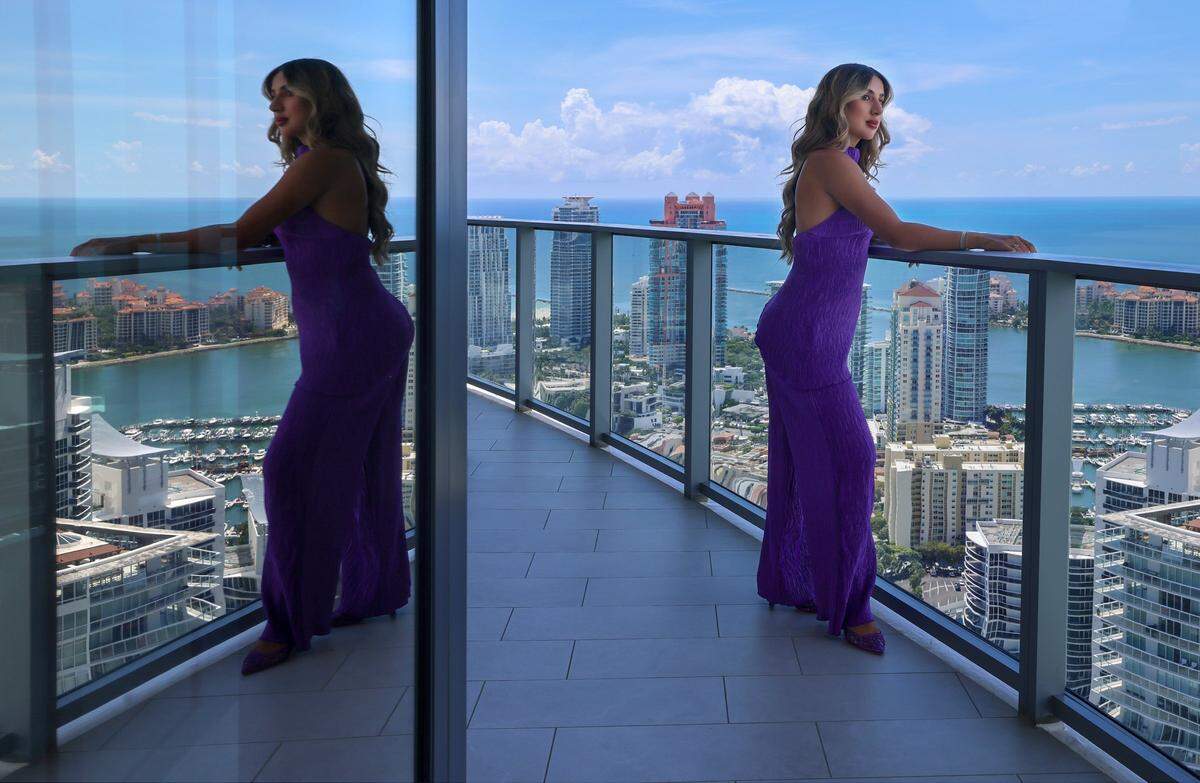 Daniela Alexandre, a luxury condo realtor, is photographed inside one of her current listings valued at $21 million at the Five Park on Tuesday, August 20, 2025, in Miami Beach, Florida. Daniela became a real estate agent a year and a half ago, and currently works at Douglas Elliman.