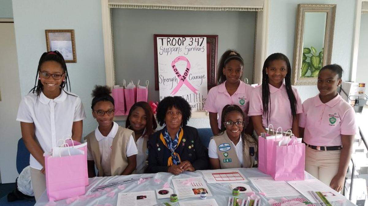 Girl Scout Leader Janice Coakley, 62, poses with the scouts from Miami Gardens’ Troop 347, which she founded in the late 1980s. Coakley received the 2020 Judge Edith Atkinson Award from the Girl Scouts of Tropical Florida, named after the first female judge of Dade County, who founded the county’s first Girl Scout Council in 1924.