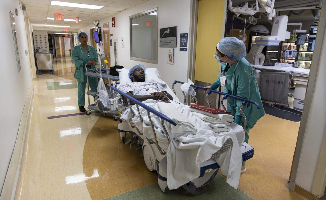 Chevon Byfield, 39, who suffers from heart failure and relies on a left ventricular assist device (LVAD), is taken to an operating room for a procedure at Memorial Regional Hospital on Tuesday, Feb. 3, 2026, in Hollywood, Fla.