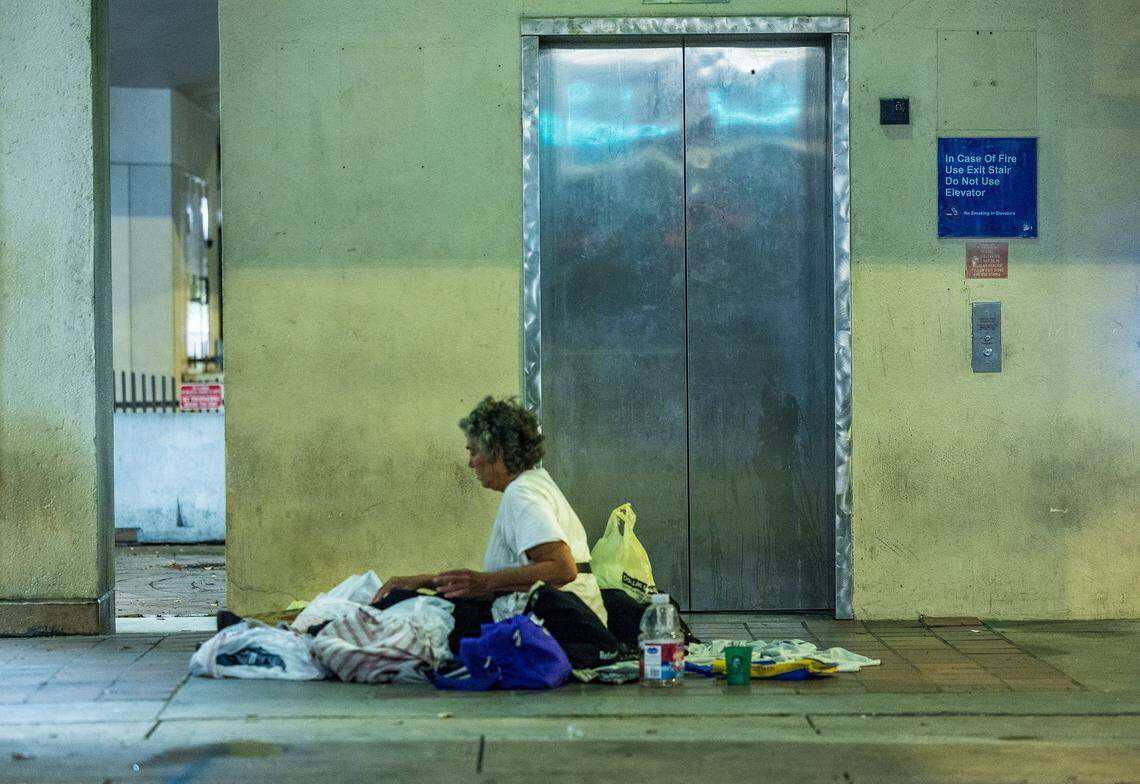 Rebecca Sadoff, 67, sits outside the Stephen P. Clark Government Center on Friday, Aug. 22, 2025 in Miami, Fla. 