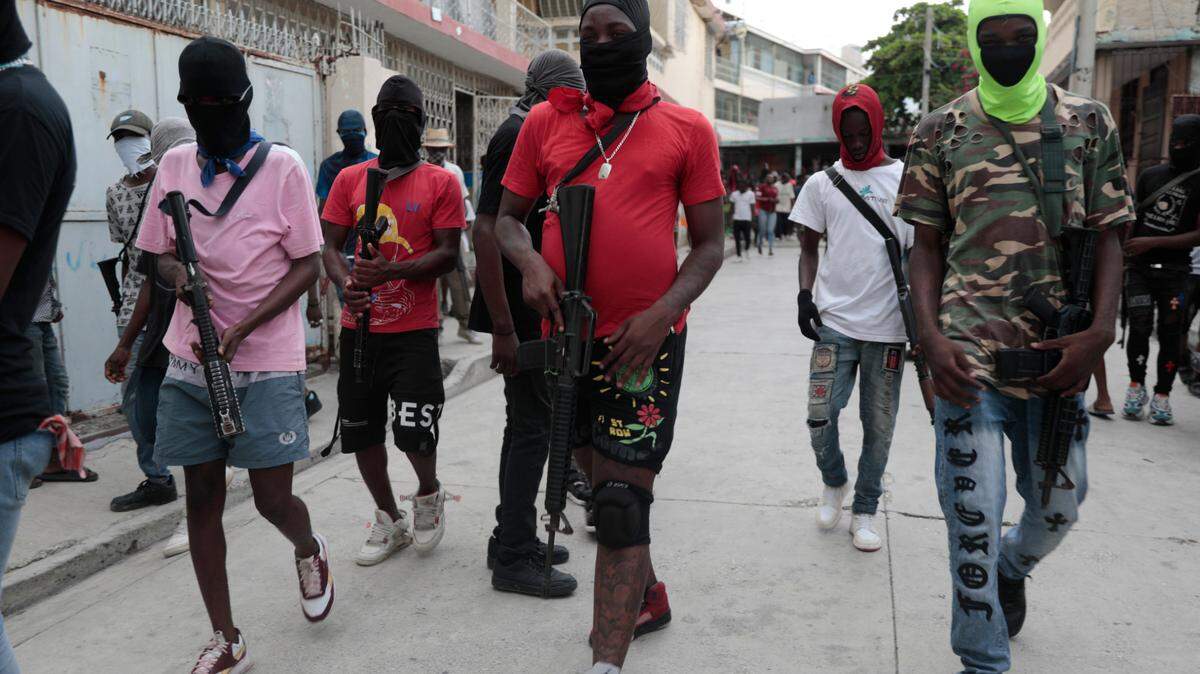 Armed members of “G9 and Family” march in a protest against Haitian Prime Minister Ariel Henry in Port-au-Prince, Haiti, Tuesday, Sept. 19, 2023. (AP Photo/Odelyn Joseph)