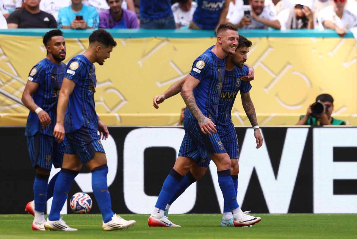 [Subscription Customers Only] Jun 18, 2025; Miami Gardens, Florida, USA; Al Hilal FC midfielder Ruben Neves (8) celebrates scoring their first goal with midfielder Sergej Milinkovic-Savic (22) during a group stage match of the 2025 FIFA Club World Cup at Hard Rock Stadium. Mandatory Credit: Hannah Mckay-Reuters via Imagn Images