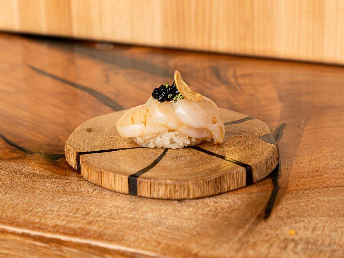 Hokkaido scallop with white truffle salt, shaved black truffle and truffle caviar at Sushi Bar in Miami Beach. “Hokkaido scallops are the best scallops in the entire world,” says chef Ambrely Ouimette.