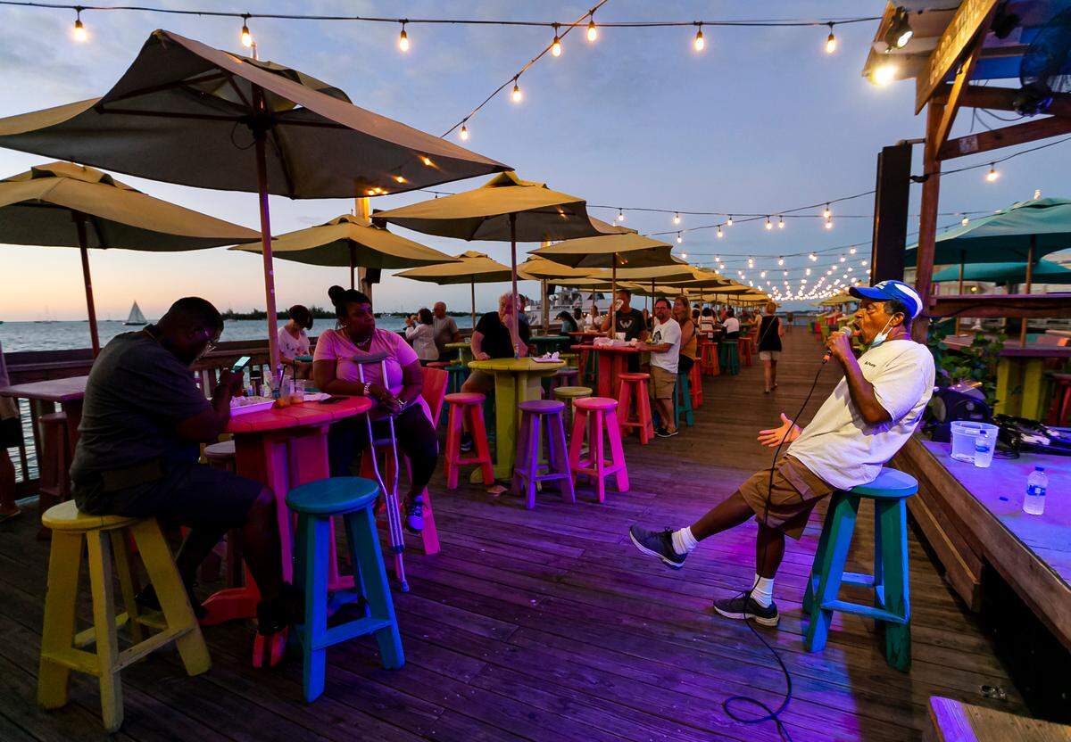 Robert Albury performs with his band at Sunset Pier in Key West on Sunday, Dec. 12, 2021.