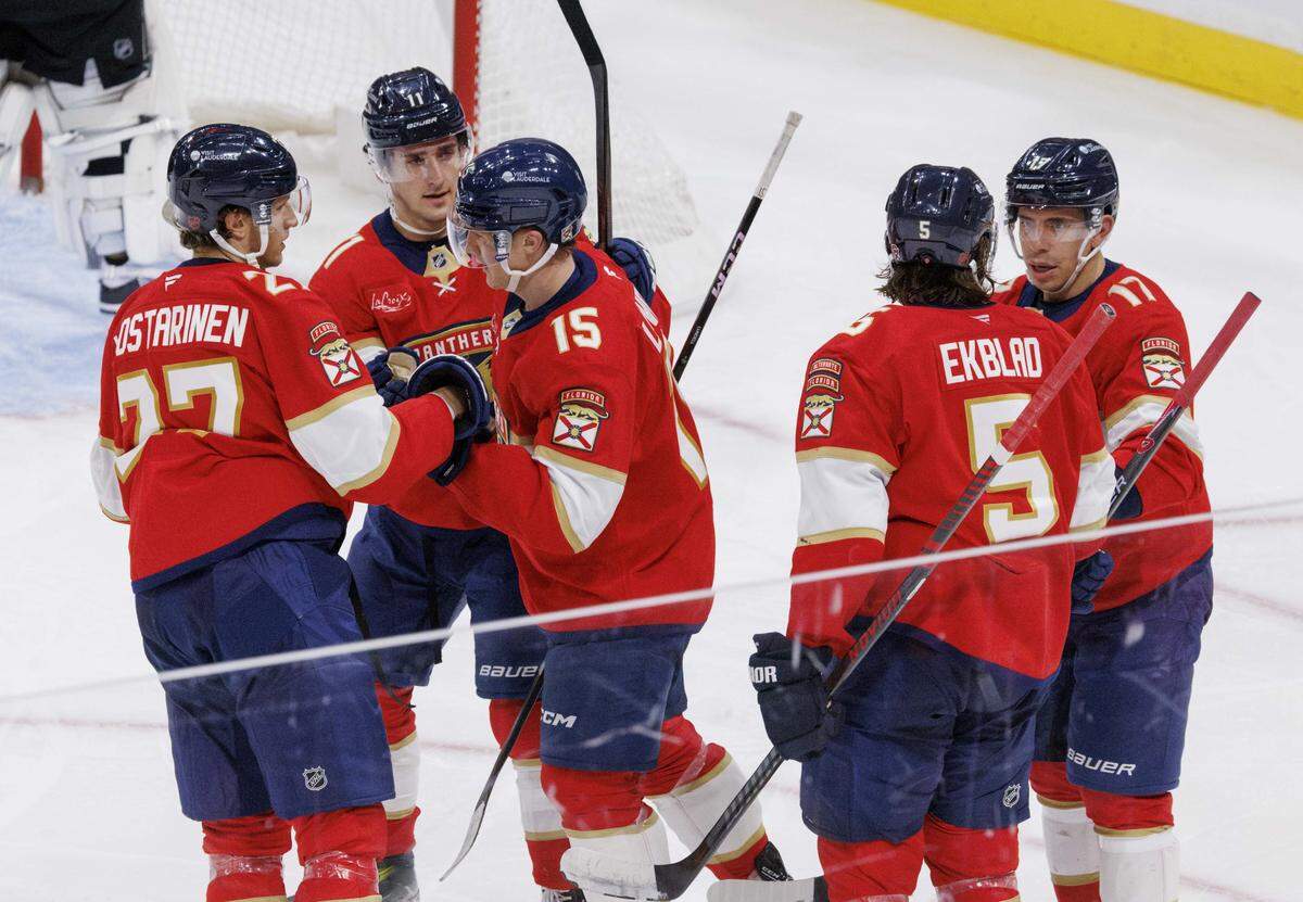 Florida Panthers center Anton Lundell (15) celebrate his goal with teammates during the second period of a game against the Los Angeles Kings on Wednesday, Dec. 17, 2025, at Amerant Bank Arena in Sunrise, Fla. 