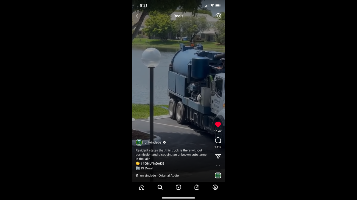 A screenshot of the video posted to the OnlyInDade Instagram account that shows a South Florida Vac-Con truck pumping some kind of water into a residential pond.