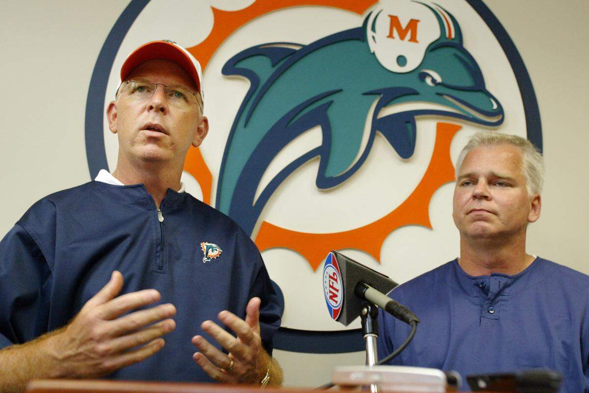 Miami Dolphins head coach Cam Cameron (left) and Randy Mueller, Dolphins general manager, speak to the media after mini camp at the team’s headquarters in Davie, Florida, Sunday, April 14, 2007.