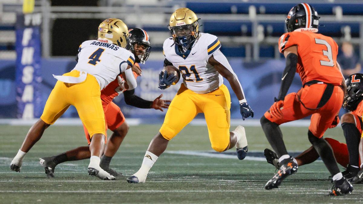 St. Thomas Aquinas running back Chance Washington (21) on a carry against Lakeland Dreadnaughts in the first half during the Florida High School Football State Championships - Class 5A game at Pitbull Stadium on the campus of Florida International University in Miami, Florida, on Thursday, December 12, 2024.