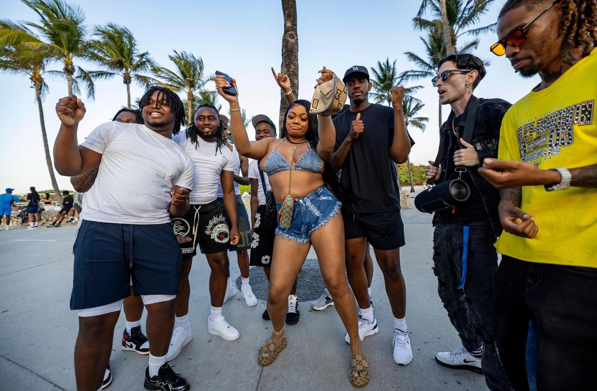 A group of people shoot a dance video in Lummus Park during spring break on Saturday, March 15, 2025, in Miami Beach, Fla.