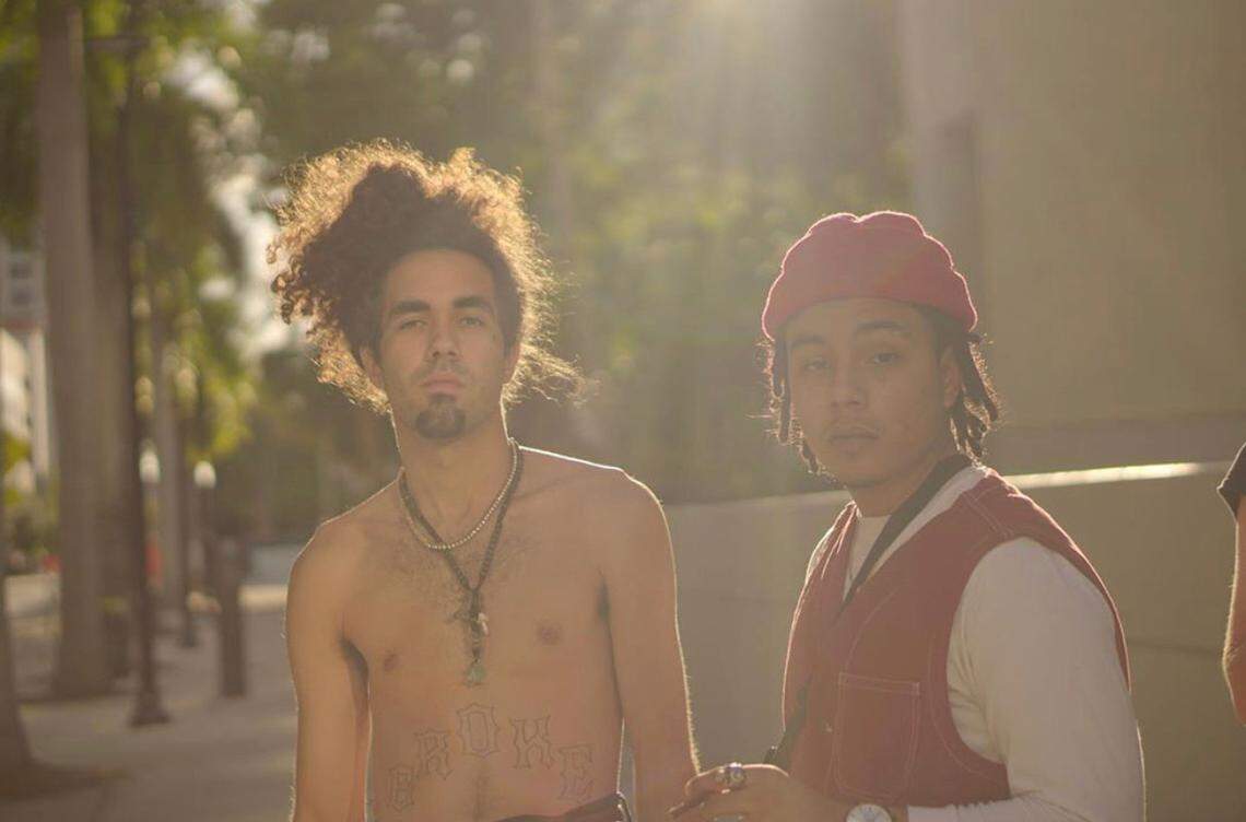 Marco Lopez, left, with Angel Martinez, both members of the Miami rap group called “Southern Slaves.”