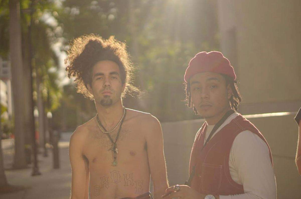 Marco Lopez, left, with Angel Martinez, both members of the Miami rap group called “Southern Slaves.”