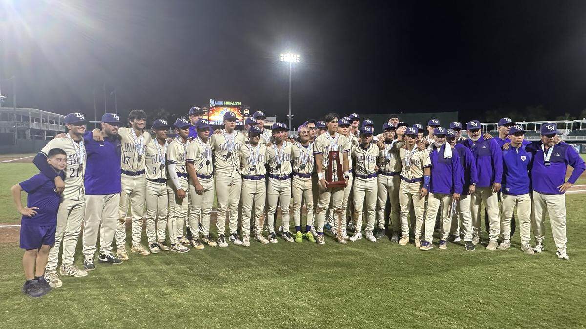The True North baseball team poses with the Class 2A state runner-up trophy after losing Tuesday night to Jacksonville Trinity Christian in the 2A final at Hammond Stadium in Fort Myers, Fla.