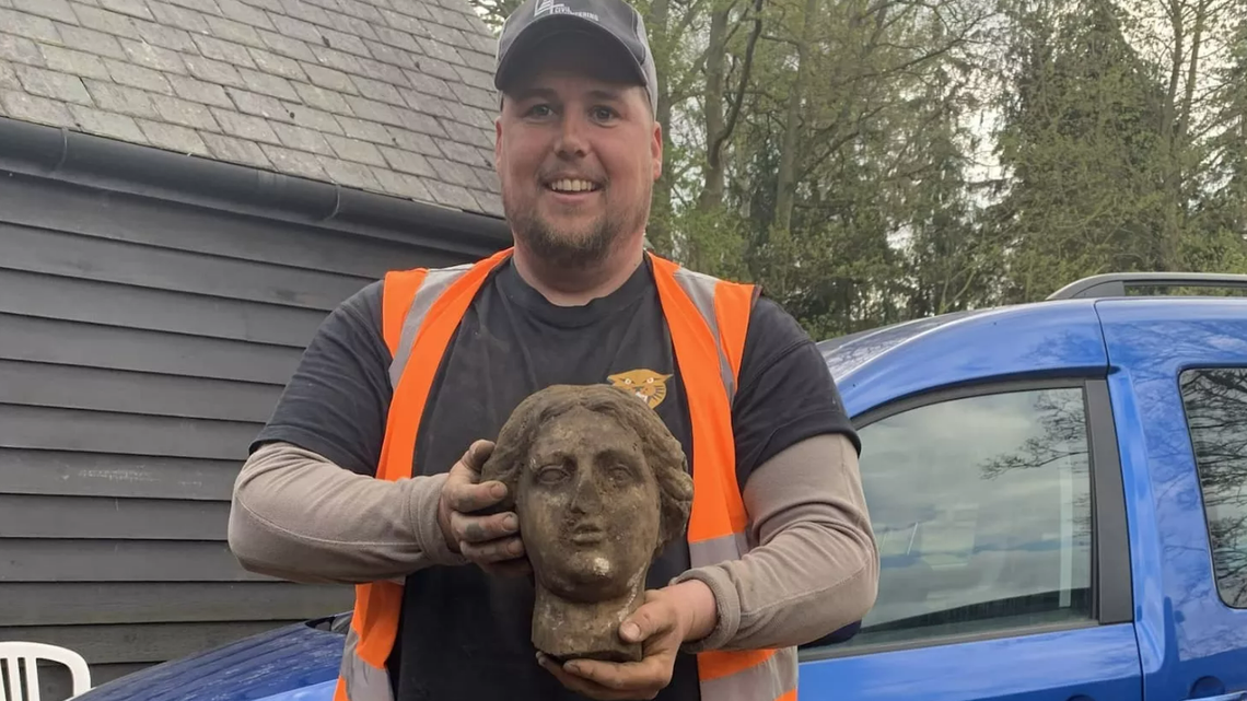 Greg Crawley accidentally discovered a “mysterious” 1,800-year-old Roman statue while using a digger during parking lot construction in the United Kingdom, according to Burghley House officials.
