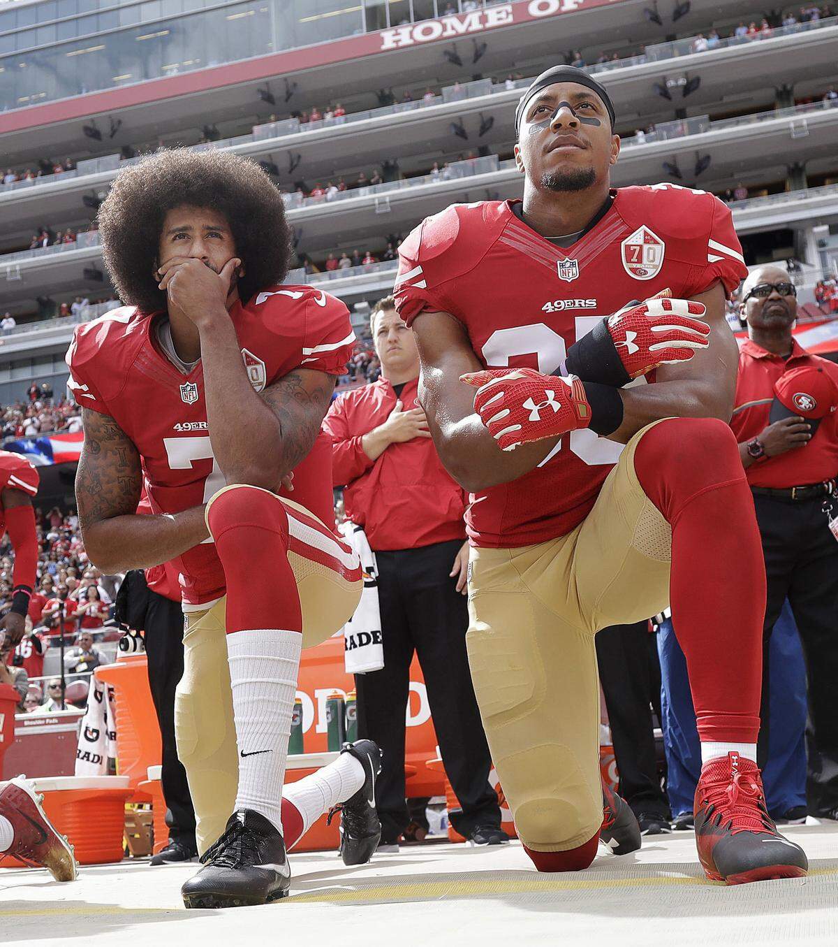In this Oct. 2, 2016, file photo, San Francisco 49ers quarterback Colin Kaepernick, left, and safety Eric Reid kneel during the national anthem before a game againast the Dallas Cowboys. The Carolina Panthers have signed the free agent safety to a one-year contract.