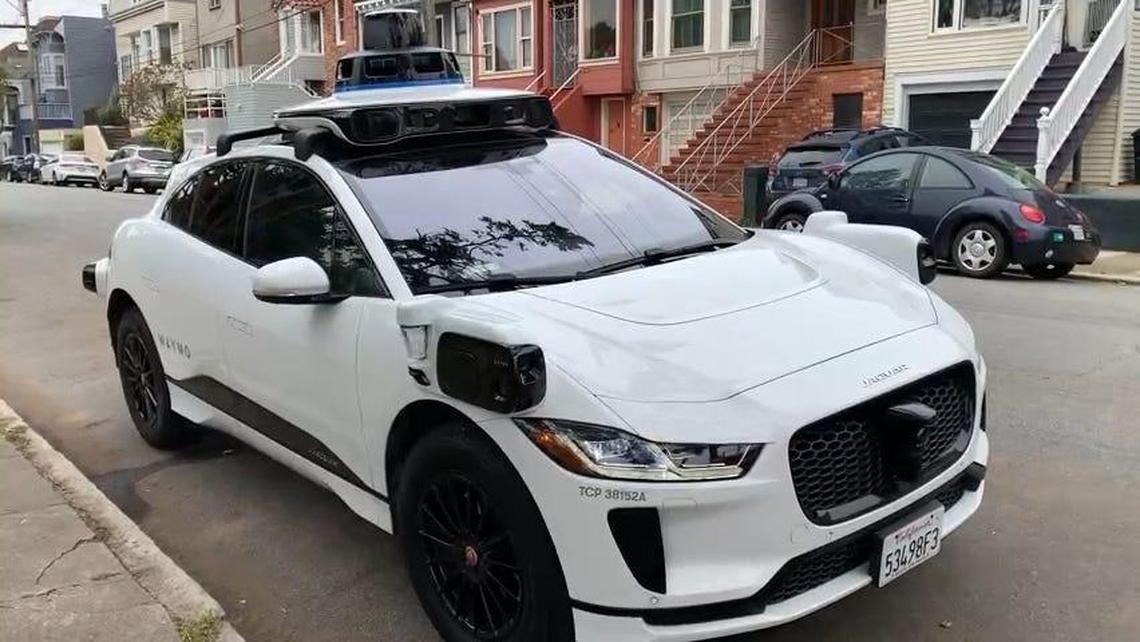 A Waymo self-driving car parked on a street in San Francisco on April 29, 2023. After several minutes in a parking space, the car backed up, pulled out into the street and drove off. There was no one in the car during the entire process.