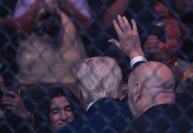 President Donald Trump waves to fans as he arrives to UFC 327 at the Kaseya Center on Saturday, April 11, 2026, in downtown Miami, Fla.