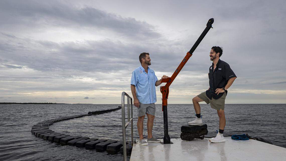 Everglades Oysters co-founders Josh Wilkie, left, and Fabio Galarce are photographed at their oyster farm off Panther Key, near Cape Romano, in the Ten Thousand Islands on Wednesday, Sept. 17, 2025, in Florida.