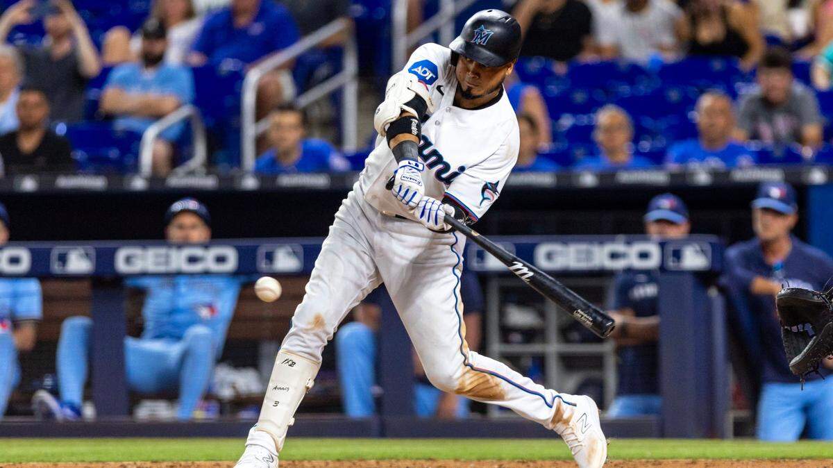 Miami Marlins batter Luis Arraez (3) hits the ball during the ninth inning of an MLB game against the Toronto Blue Jays at LoanDepot Park on Tuesday, June 20, 2023, in Miami, Florida.