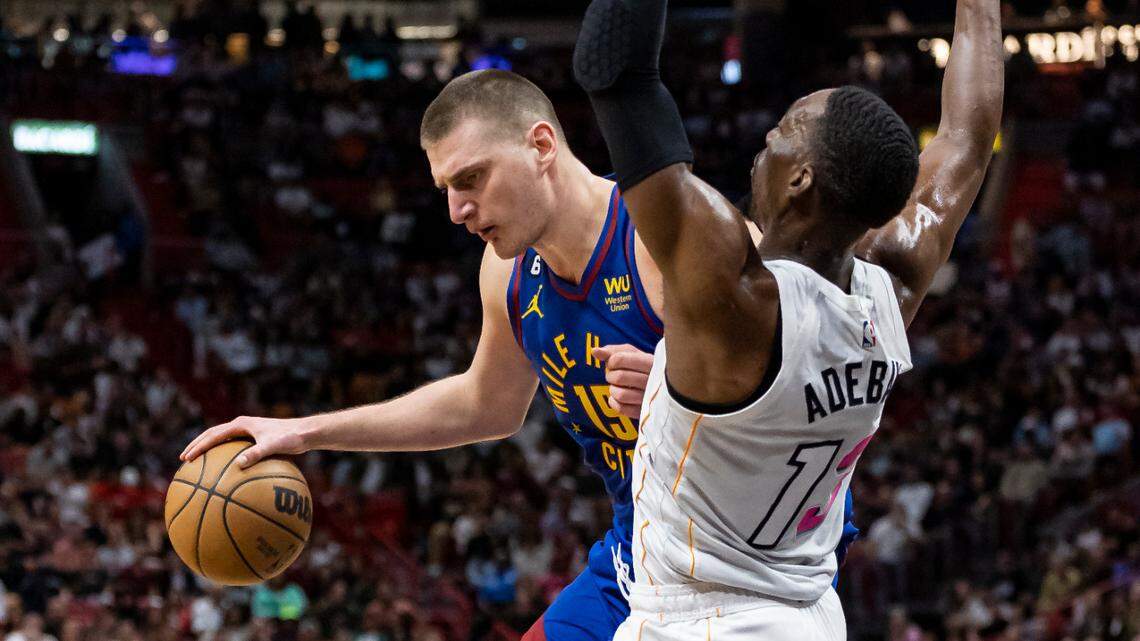 Miami Heat center Bam Adebayo (13) defends against Denver Nuggets center Nikola Jokić (15) during the fourth quarter of an NBA game at the Miami-Dade Arena on Monday, Feb. 13, 2023, in downtown Miami, Fla.