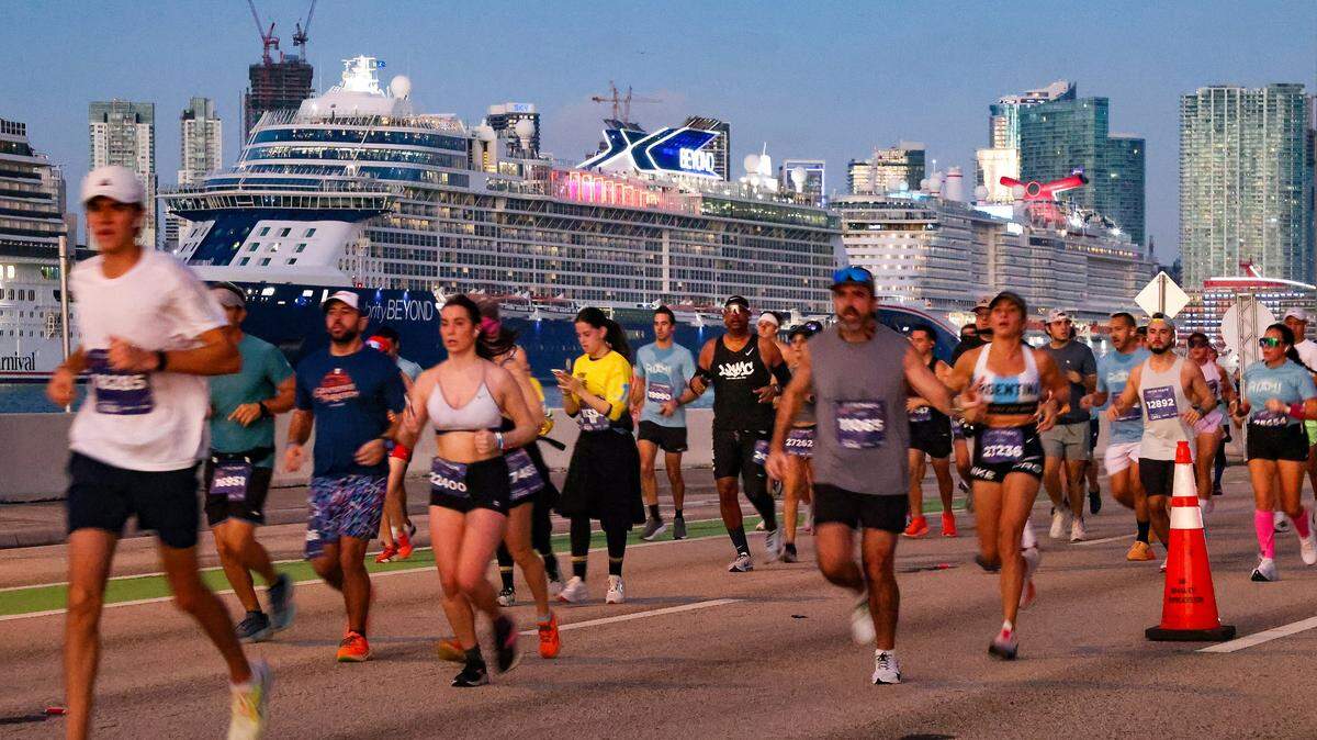Runners head eastbound on the MacArthur Causeway, running past docked cruise ships at the Life Time Miami Marathon & Half on Sunday, January 25, 2026, in Miami, Florida.