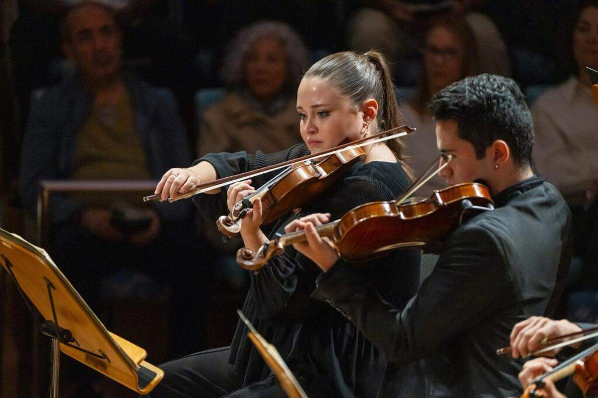 Second year NWS fellow and violinist Hannah Corbett is concert master for “American Dream Odyssey.”