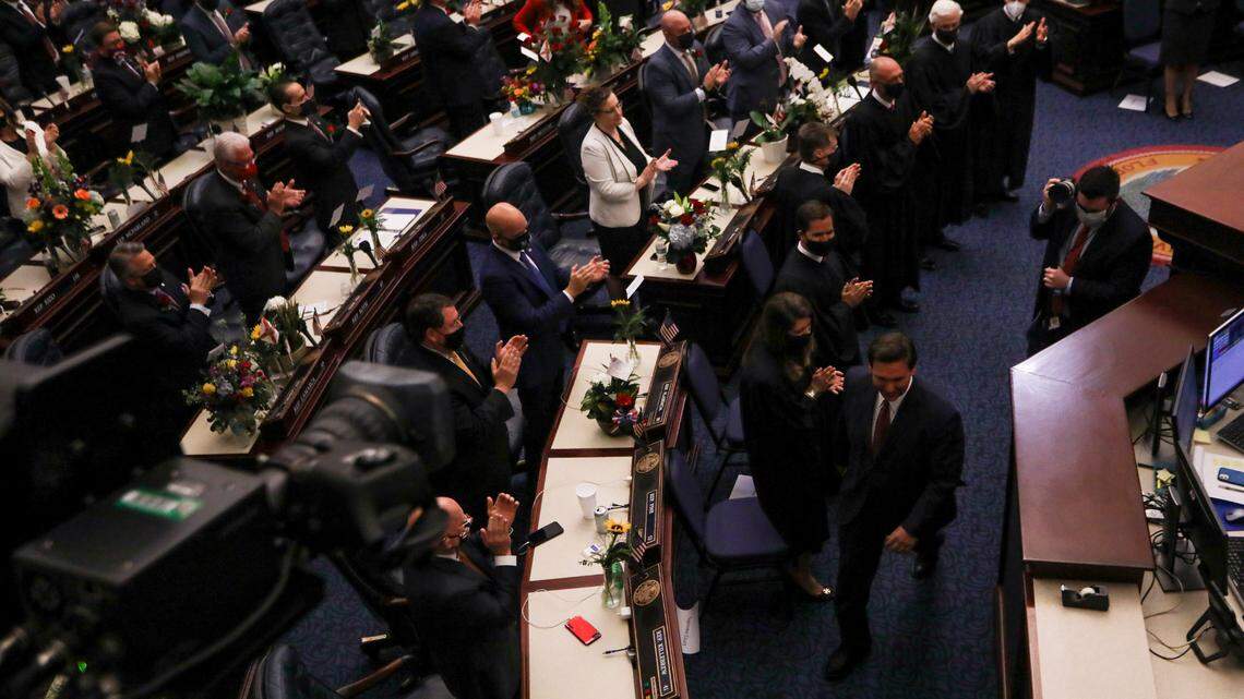 Gov. Ron DeSantis is applauded in the House chamber as he walks up to the podium to address the joint session of the Florida Legislature at the Capitol in Tallahassee on Tuesday, March 2, 2021.