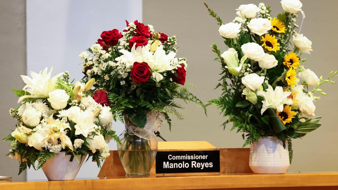 The vacant seat of Manolo Reyes, who died last week, sits with flowers during a special meeting to decide how to fill the seat on Thursday, April 17, 2025, at Miami City Hall in Coconut Grove. The council voted unanimously to hold a special election, proposed to be June 3, to fill the seat.