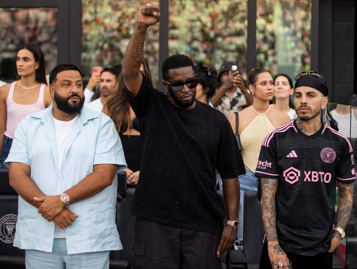 From left to right: DJ Khaled, Sean Combs and Rauw Alejandro are seen before the start of a Leagues Cup group stage match between Inter Miami and Atlanta United at DRV PNK Stadium on Tuesday, July 25, 2023, in Fort Lauderdale, Fla.