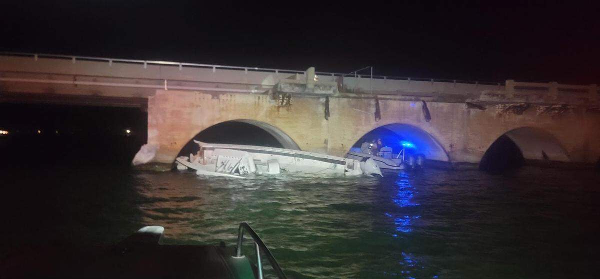 A badly damaged Sea Hunter center console floats next to the South Pine Channel Bridge in the Lower Florida Keys on Monday, July 8, 2024.